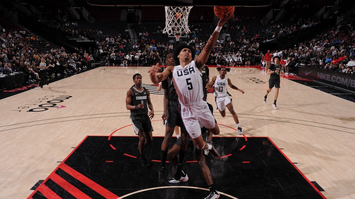 Dylan Harper of Team USA drives to the basket during the game against Team World during the 2024 Nike Hoop Summit on April 13, 2024 at the Moda Center Arena in Portland, Oregon.