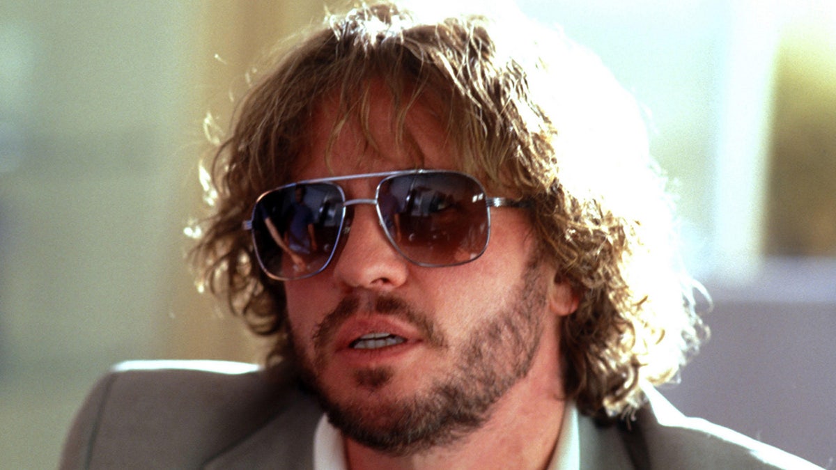 Val Kilmer dressed as John Holmes