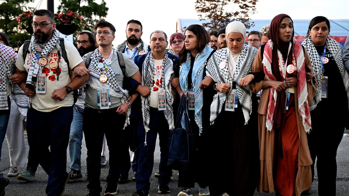 Pro-Palestinian uncommitted delegates take part in a demonstration outside the venue on Day 4 of the Democratic National Convention (DNC).