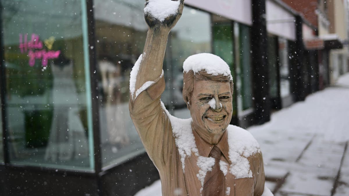 Snow covers a statue of former President Carter on March 21, 2023, in Rapid City, S.D.