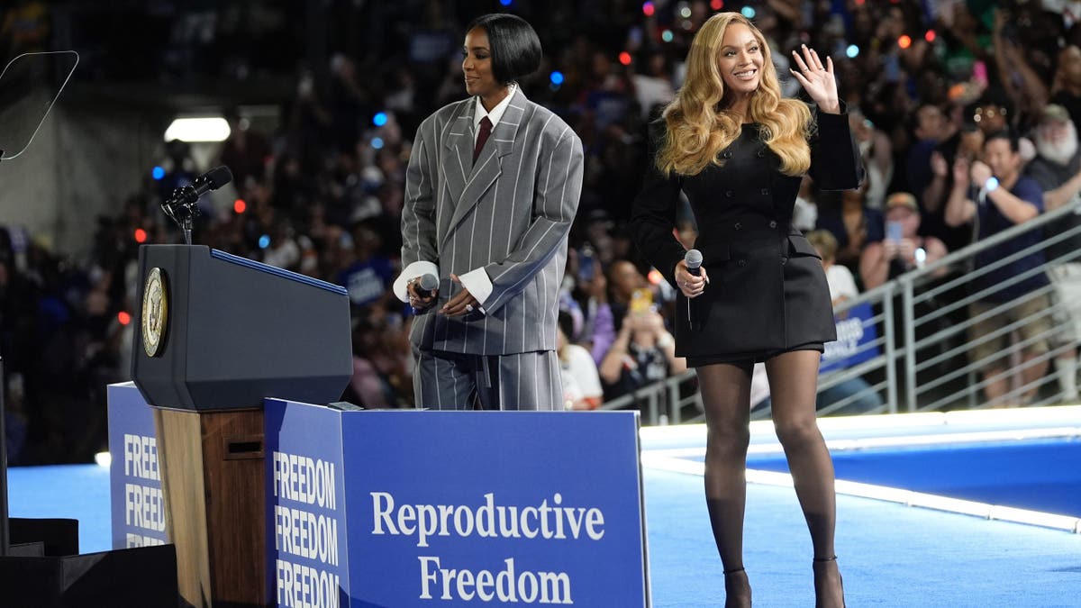 Musical artists Beyoncé, right, and Kelly Rowland, left, on stage at a campaign event for Democratic presidential nominee Vice President Kamala Harris in Houston, Friday, Oct. 25, 2024. (AP Photo/Susan Walsh)