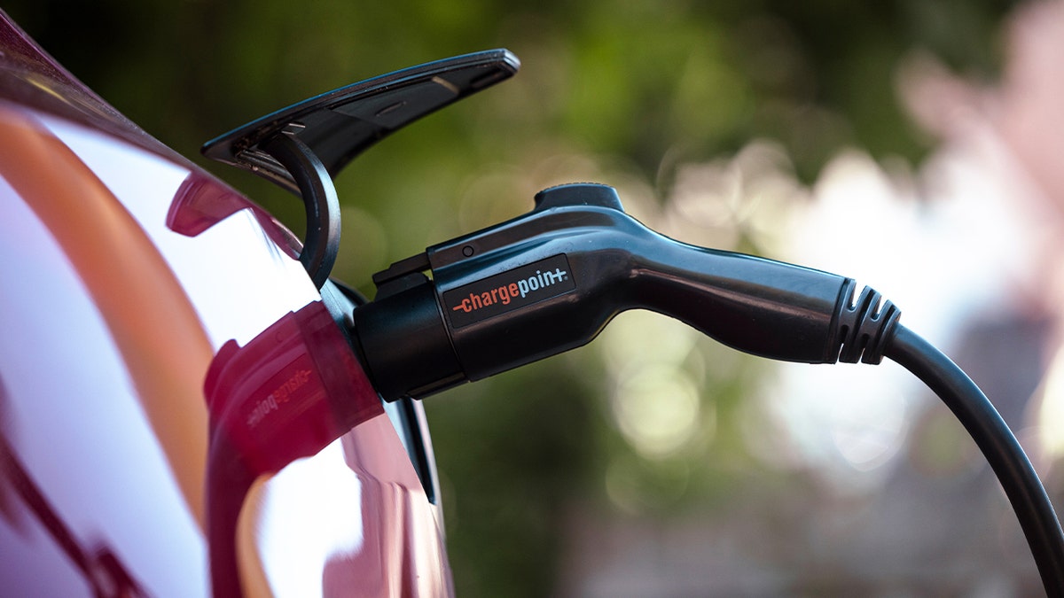 A Tesla Model 3 charges at a ChargePoint electric vehicle charging station in Rhinebeck, New York, on Sept. 3, 2024.