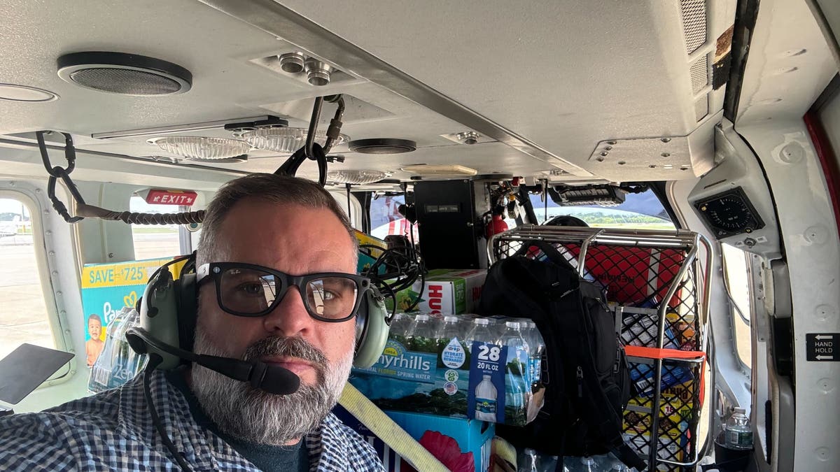 Rep. Cory Mills inside helicopter on NC rescue mission