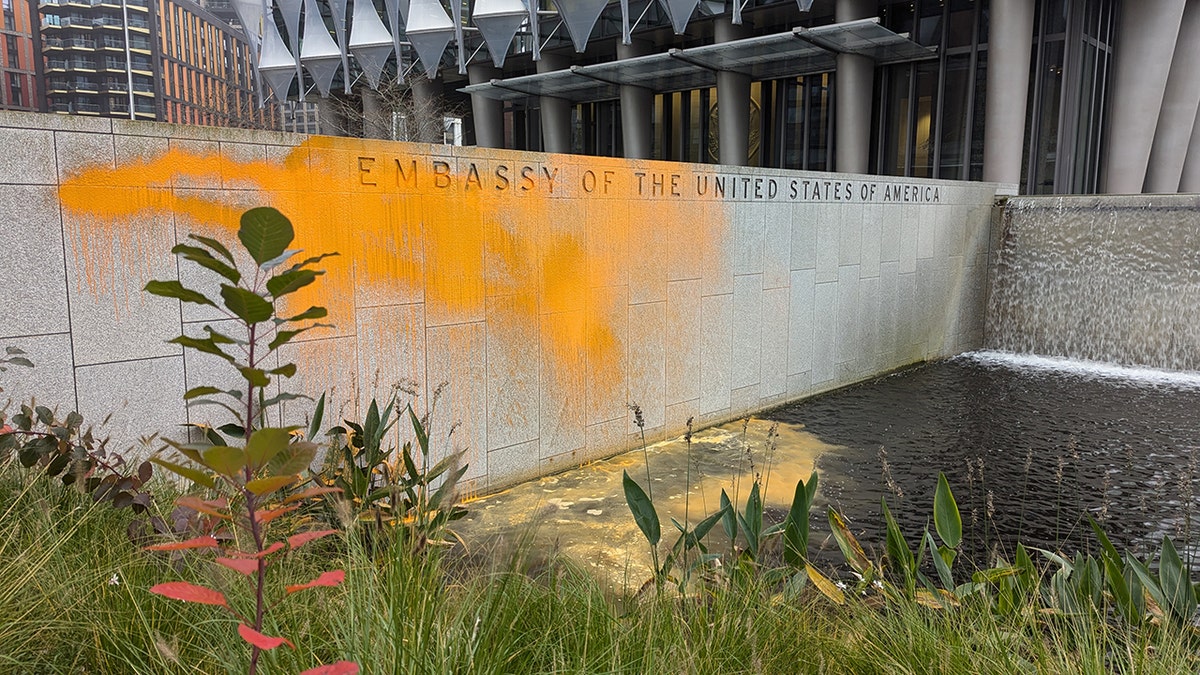 U.S. embassy in London exterior wall covered in orange paint