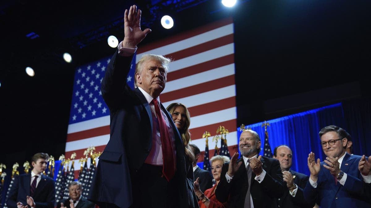 Donald Trump waves to supporters in West Palm Beach, Florida.