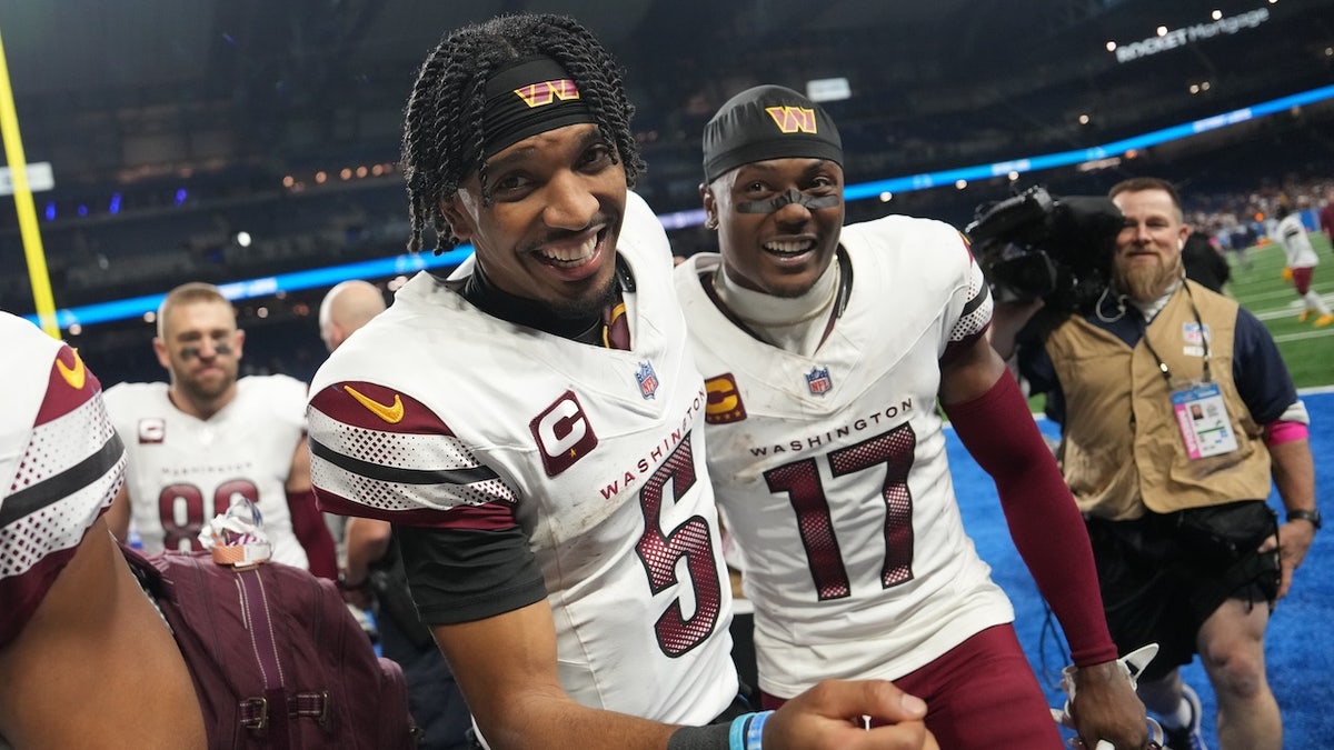 Jayden Daniels #5 of the Washington Commanders celebrates with Terry McLaurin #17 after defeating the Detroit Lions 45-31 in the NFC Divisional Playoff at Ford Field on January 18, 2025 in Detroit, Michigan.  