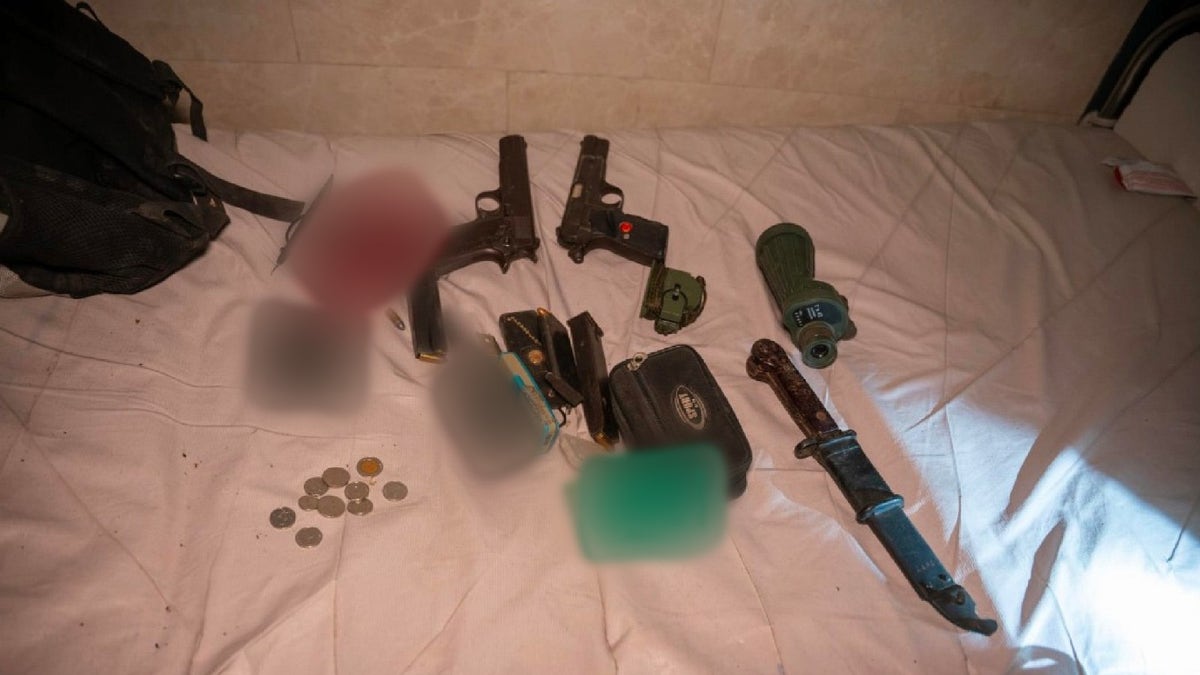 Photo showing weapons found inside and around Kamal Adwan Hospital in Gaza by IDF troops.