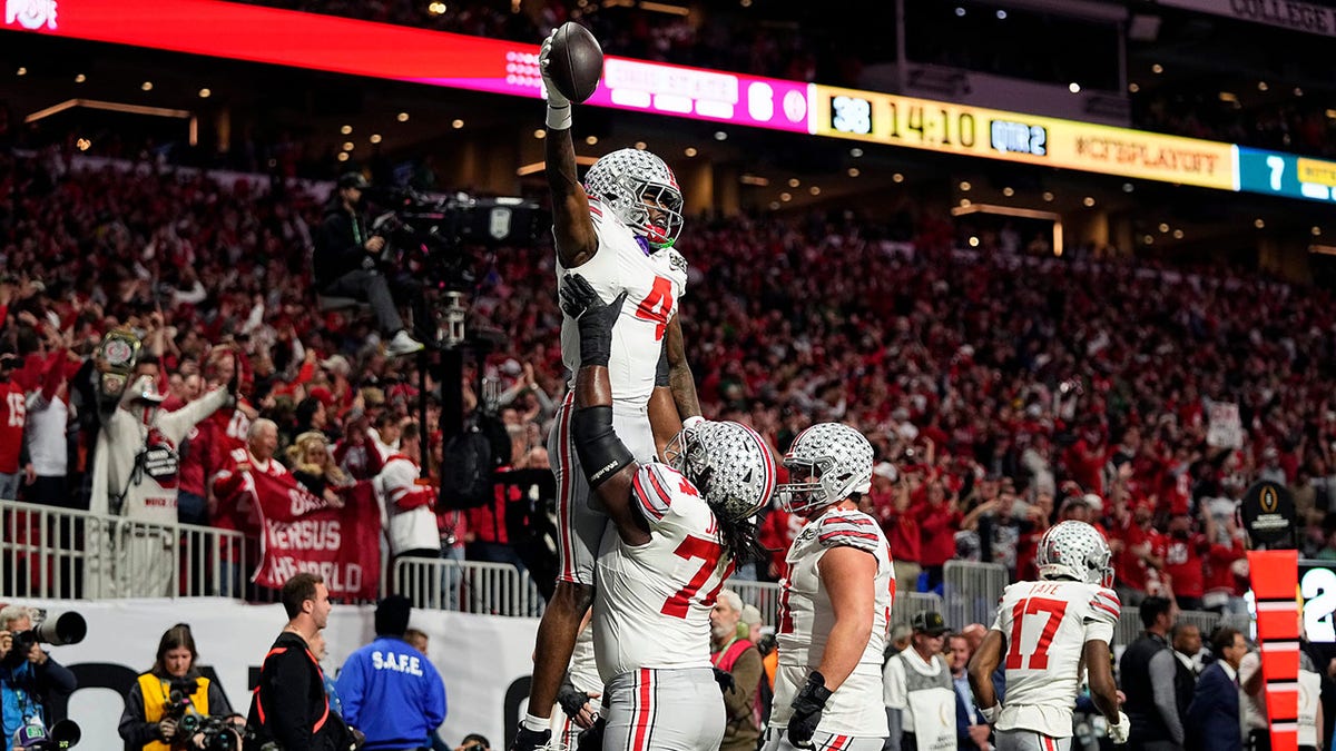 Jeremiah Smith lifted after scoring touchdown