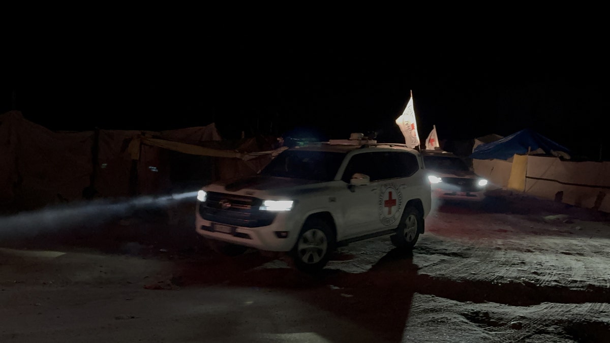 Red Cross vehicles carrying hostages' bodies